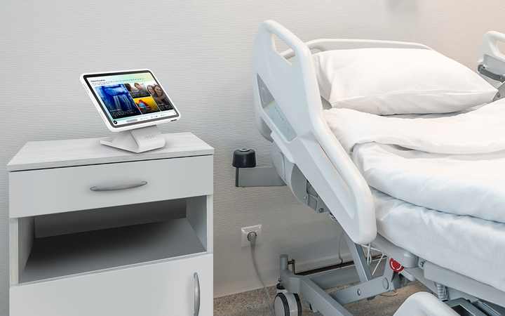 iPad mounted at hospital bedside for patient engagement using IPORT