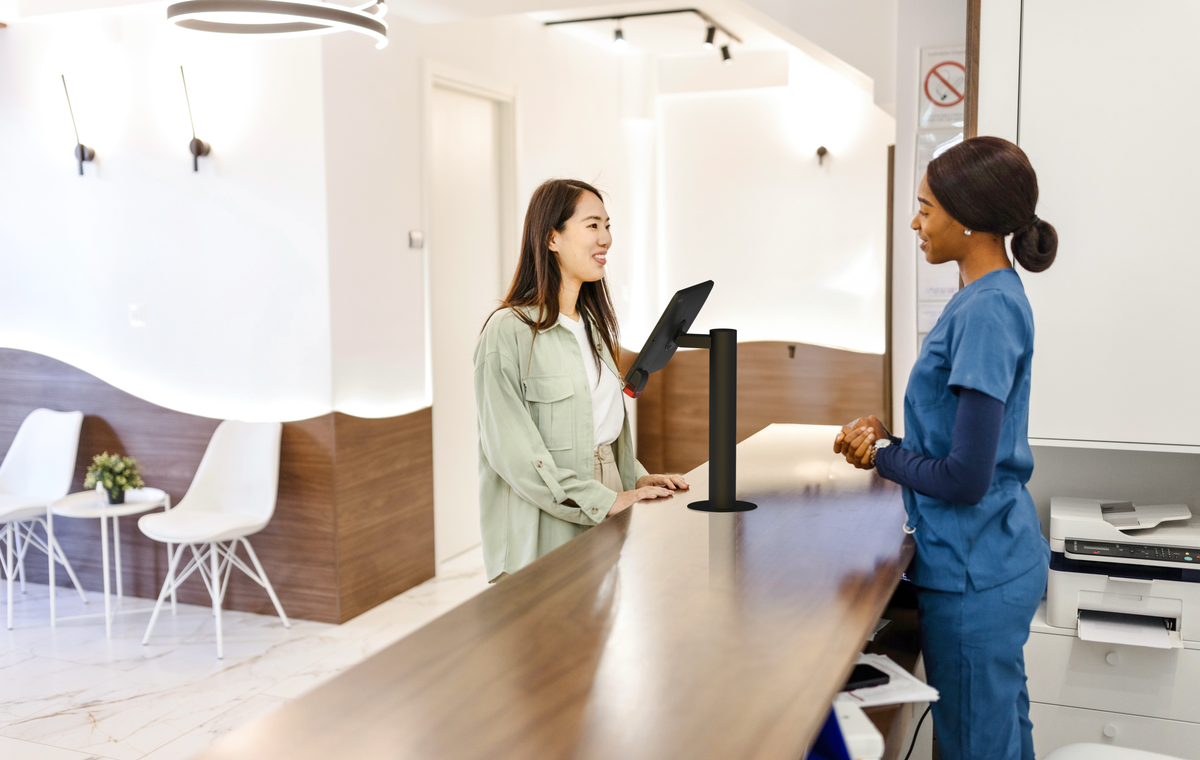 Digital patient check-in kiosk with iPad and IPORT stand at hospital reception
