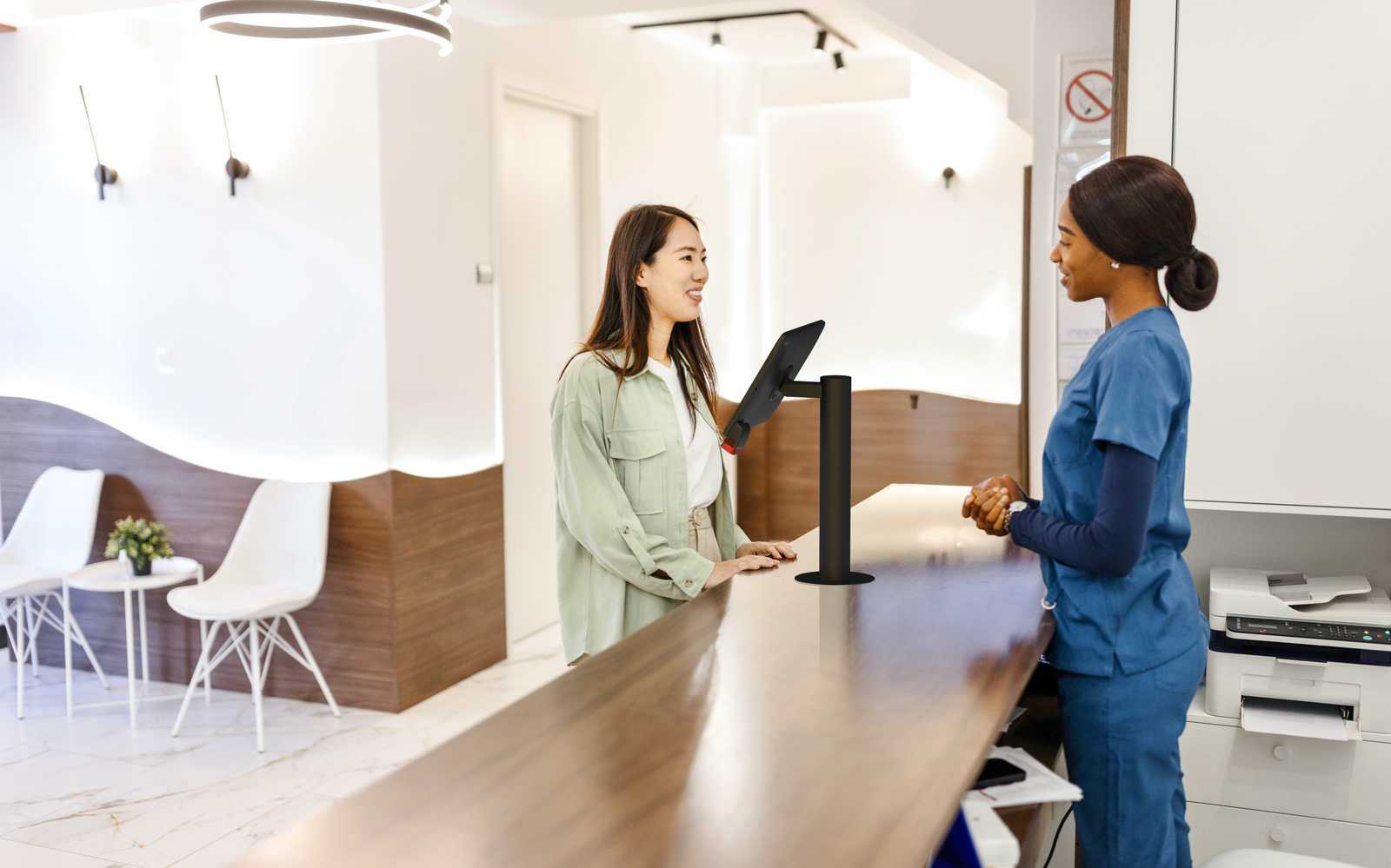 Digital patient check-in kiosk with iPad and IPORT stand at hospital reception