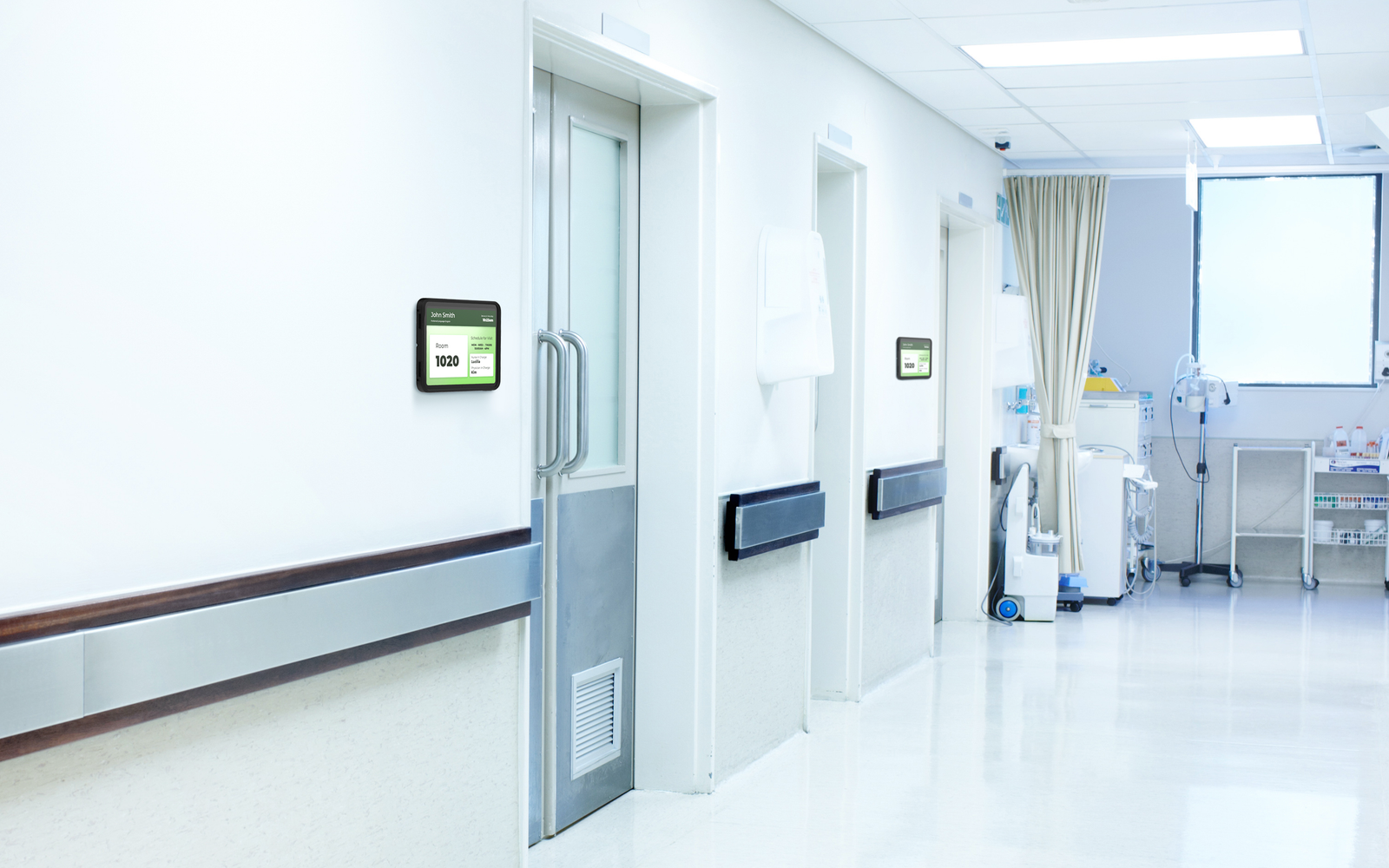 iPad digital door sign outside hospital patient room with IPORT mount